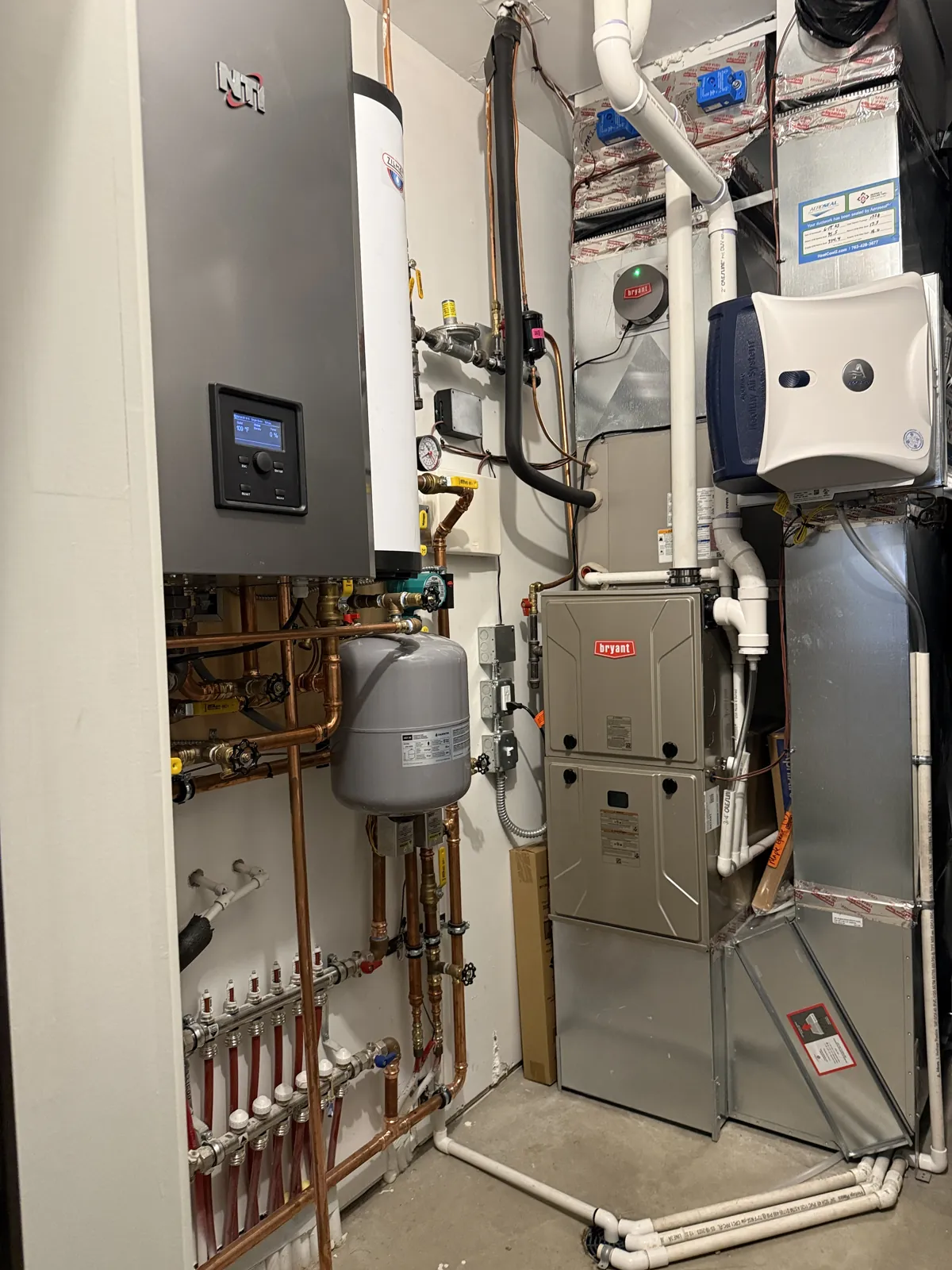 Finished Waconia, MN mechanical room with furnace, humidifier, and boiler system