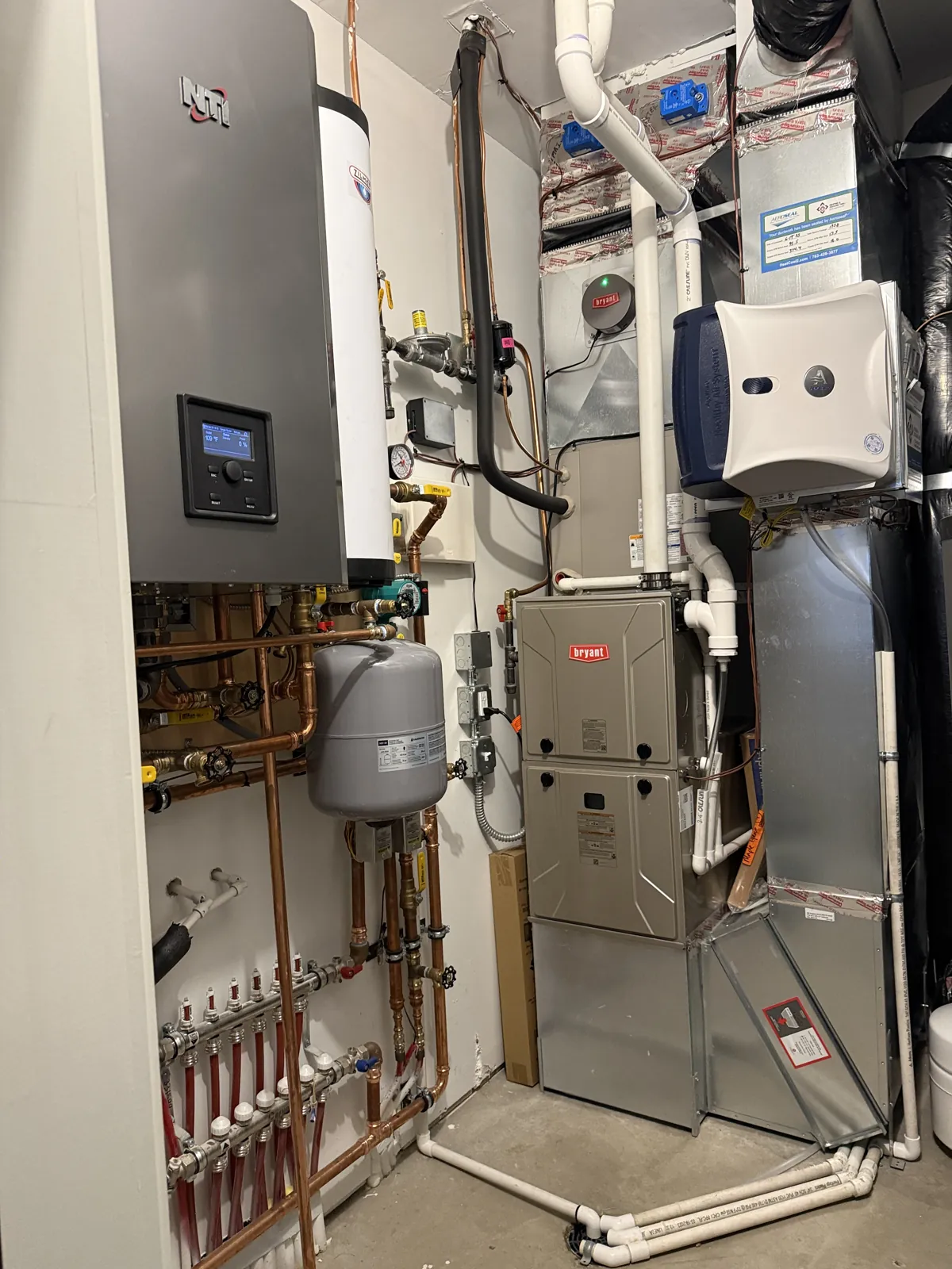 Complete mechanical room with boiler, Bryant furnace, and radiant heating in Waconia, MN