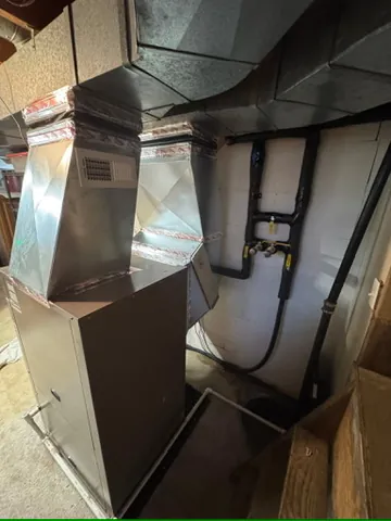 New geothermal heat pump connected to existing ductwork in Dayton, MN